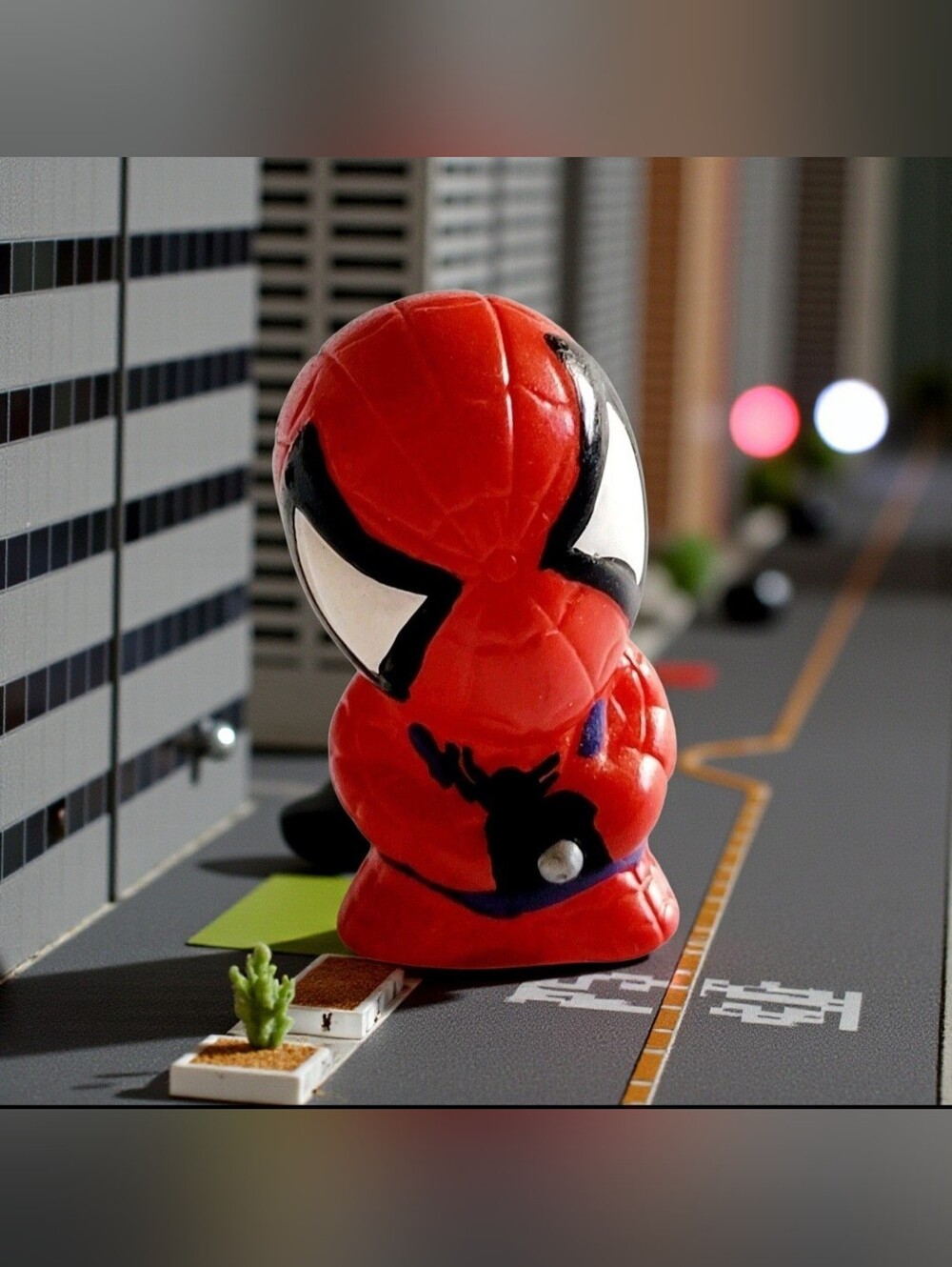 2-inch Mini Spider-Man Pencil Topper Chibi Style Figure Holding A Small Camera.